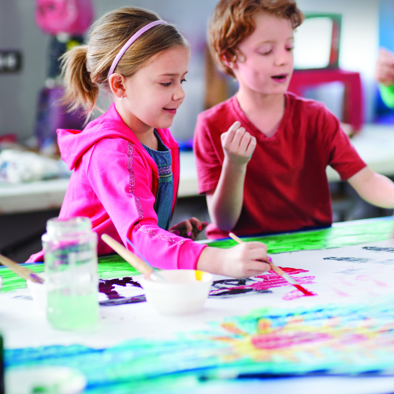 two student enjoying time being creative in art class