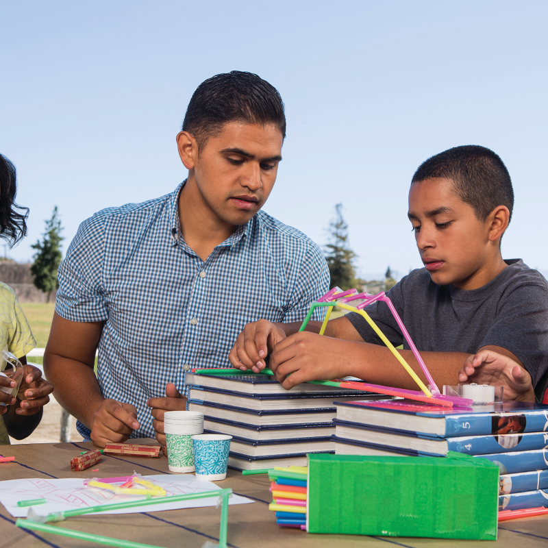 A teacher helping a student for summer classes