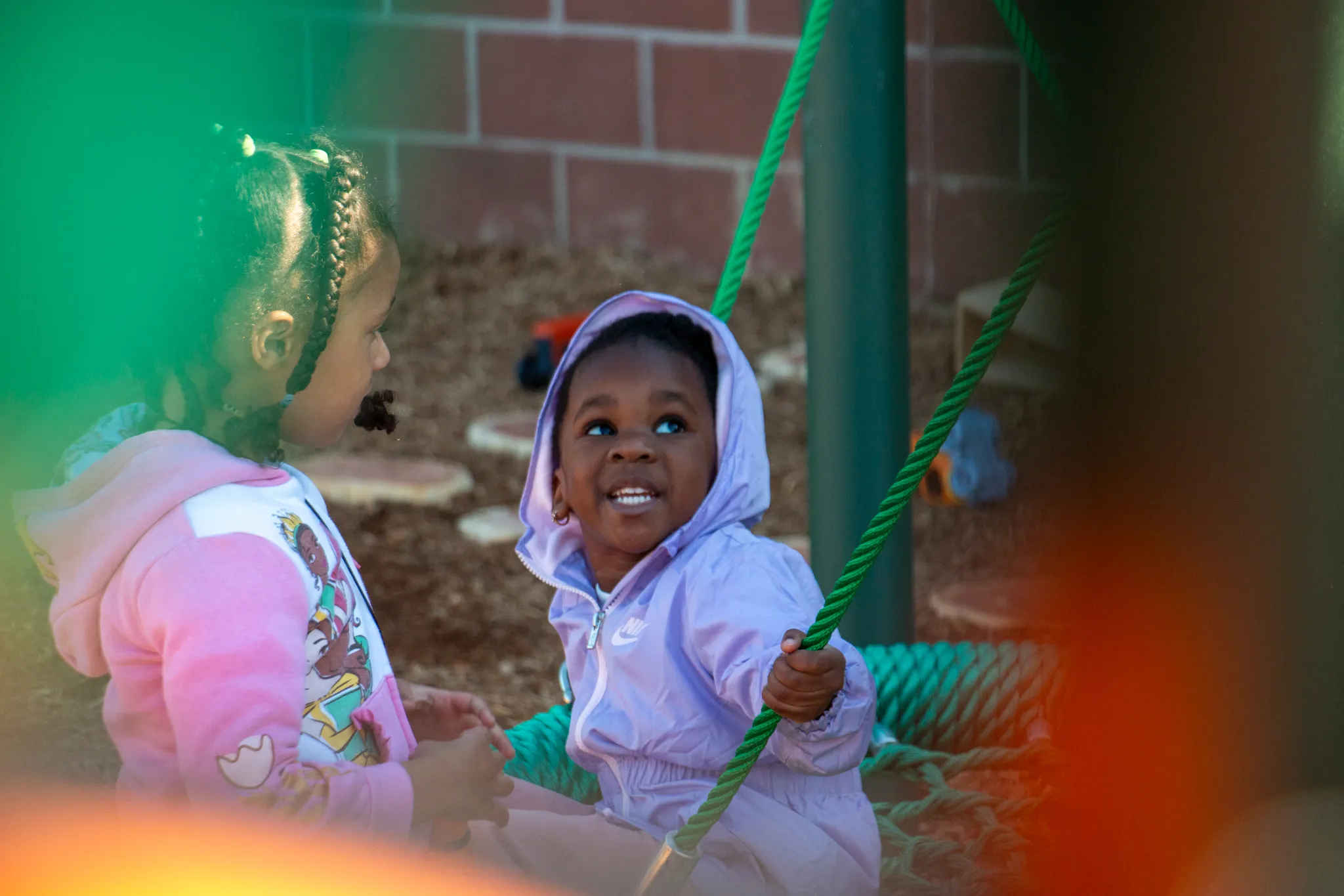 A youth enjoy time on the new playground at Hilltop.