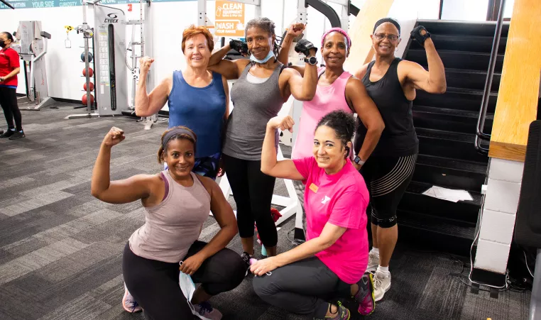 A group of women flexing after a workout