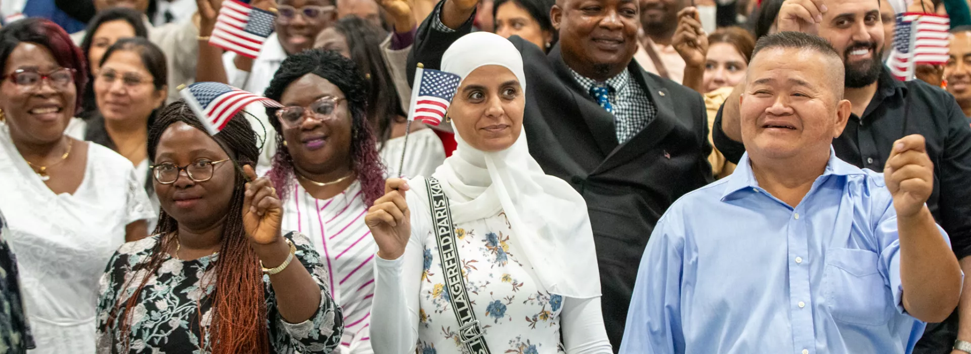 People waving U.S. flags